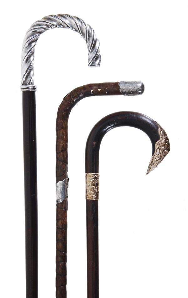 A gold plated metal mounted stained hardwood walking stick, first quarter 20th century, the crook