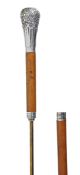 A Continental paste set silver plated metal mounted stained hardwood system walking stick, circa