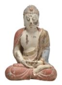 A Chinese wood figure of a Buddha, seated with crossed legs and hands, the chest bared, clothes in