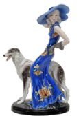 Claire Herczeg for Goldscheider, an Art Deco pottery figure of a lady with borzoi, in a flowing