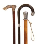 A white metal mounted malacca walking stick, first half 19th century, the tapered knob grip cast