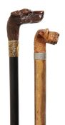 A Victorian carved wood and gilt metal mounted walking stick, late 19th century, the grip modelled