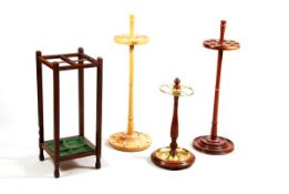 An Edwardian stained oak stick stand, early 20th century, of square section with four square