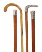 A Victorian white metal mounted malacca walking stick, last quarter 19th century, the tapered grip