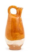 An amber glazed stoneware pilgrim flask, Liao dynasty, modelled after a leather prototype, the