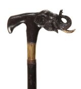 A bronze mounted ebonised wood walking stick, 20th century, the heavy grip cast as an elephant?s