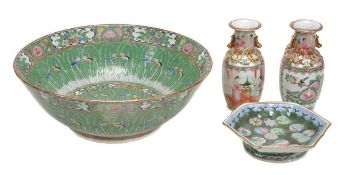 A Chinese famille rose punch bowl decorated with cabbage leaves and butterflies hovering amid