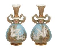 A pair of Royal Worcester two-handled vases signed by C. Baldwyn, date codes for 1897 & 1899,