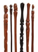 Six African carved hardwood figural walking sticks, 20th century, four with grips carved as