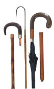 A horn and stained wood munted system walking stick, early 20th century, with crook grip above a