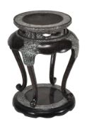 A Japanese or Korean Lacquer Stand or Table, of waisted circular section raised on four cabriole