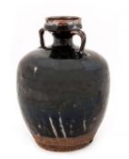 A Chinese phosphatic glaze-splashed brown-glazed stoneware flask, Song/Yuan period, the body of