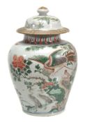 A Chinese wucai jar and an associated 18th century famille rose cover of baluster shape decorated
