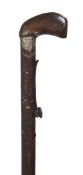 A rare Victorian under hammer muzzle loading steel walking stick gun, circa 1870, the shaped wood