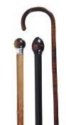 A George V tiger?s eye hardstone and silver mounted malacca walking stick, the foliate engraved