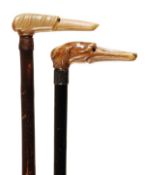 An Edwardian carved horn and white metal mounted ebonised wood walking stick, early 20th century,