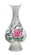 A famille rose bottle vase, 18th century, of pear shaped body decorated with butterflies hovering