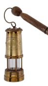 A Victorian walnut miner?s walking stick and lantern, circa 1900, the stick with ovoid grip pierced