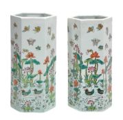 A pair of Chinese hexagonal vases decorated with butterflies hovering above geese swimming in a