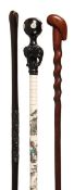 A Chinese carved and ebonised wood mounted painted bone walking stick, second half 20th century,