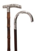 A Chinese export silver mounted stained hardwood walking stick, circa1900, the crook grip decorated