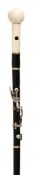 A Victorian ivory mounted faux ebony system walking stick, late 19th century, constructed as a