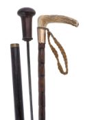 A Victorian rosewood and ebony mounted sword stick, late 19th century, the tapering grip with knob