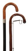 A stained wood system walking stick, early 20th century, the crook grip and shaft with a wirework