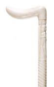 An African carved ivory walking stick, early 20th century, the horizontal handle above a shaft with