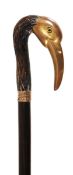 A fine gilt bronze and gold mounted rosewood walking stick, late 19th century, the grip cast as the