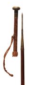 A Basque medlar wood and metal mounted makila walking stick, dated 1922, the woven leather clad