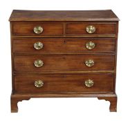 A George III mahogany chest of drawers, circa 1780, the rectangular top with moulded edge, above two