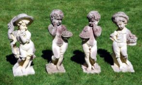 A pair of reconstituted stone garden figures of children, late 20th century, cast as standing and