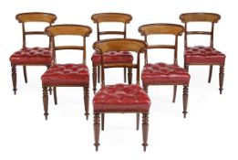 A set of six Victorian mahogany and red leather upholstered dining chairs, circa 1860, each shaped