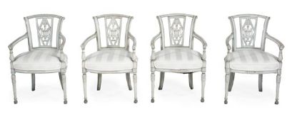 A set of four painted French provincial armchairs, 19th century, outswept back with a central carved