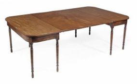 A George III mahogany extending mahogany dining table, circa 1780, with rounded ends on ring