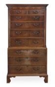 A George III mahogany chest on chest, circa 1790, with a moulded cornice,above two short and seven