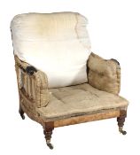 A Victorian walnut framed armchair by Howard & Sons, late 19th century, the rectangular back, padded