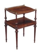 A Victorian mahogany and crossbanded two tier occasional table, circa 1860, with three carved