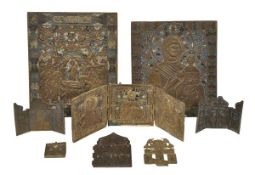 A collection of Russian brass icons and related items, comprising: two champleve enamelled icons,