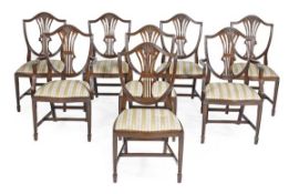 A set of sixteen mahogany dining chairs in George III style, 20th century, including two