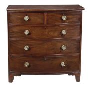 A George III mahogany bowfront chest of drawers, circa 1790, with crossbanded top above two short