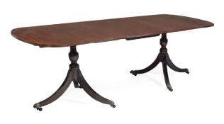 A mahogany twin pedestal dining table, in George III style, 19th century and later, with an