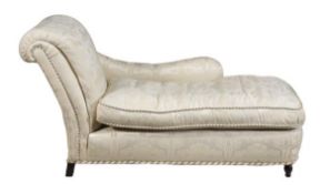 An upholstered chaise in Victorian style, of recent manufacture, with a padded back and arm rest,