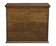 An oak and crossbanded chest of drawers, late 17th/ early 18th century, the rectangular top above
