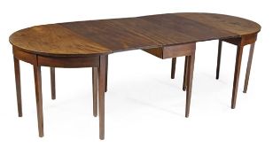 A George III mahogany D end extending dining table, circa 1780, with two D-shaped ends and a central