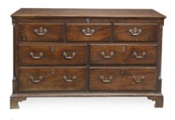 A George III mahogany mule chest, circa 1780, the hinged rectangular top above an arrangement of two