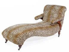 A Victorian walnut and upholstered chaise longue, circa 1870, the oval scrolling back and