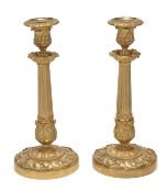 A pair of French gilt bronze candlesticks in 18th century style, late 19th century, the urn