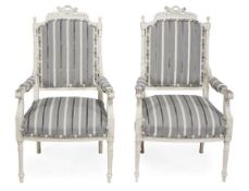A pair of carved and painted wood and upholstered armchairs in Louis XVI style, late 19th/early 20th